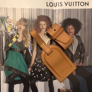 Authentic Louis Vuitton name tag and loop buckle poignet luggage.